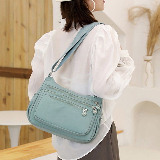 Lichtgewicht nylon crossbodytas met meerdere vakken
